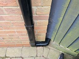 black flat faced trunking concealing pipework