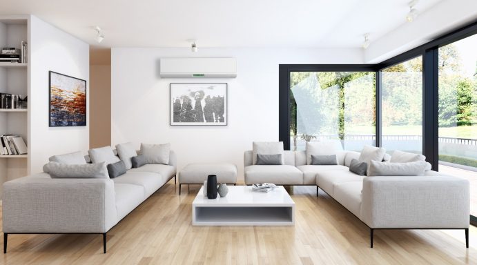 Contemporary sitting area featuring sleek white high wall indoor air conditioning unit