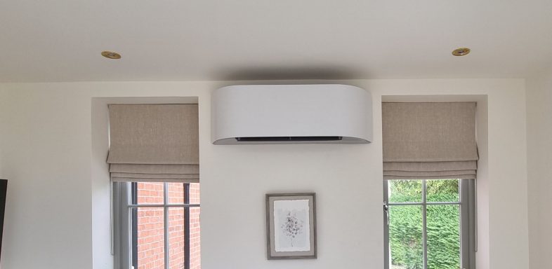 Stylish room interior with window blinds and a sleek air conditioning unit above